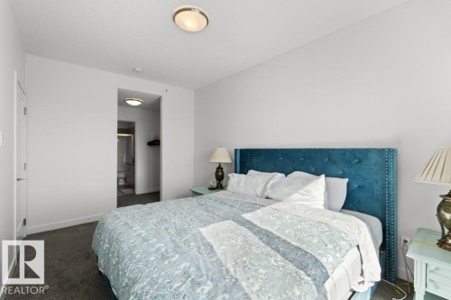 Carpeted sleeping area with white walls and ceiling - 1316 Windermere Way Sw, Edmonton, AB 