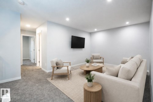 Recessed ceiling lighting, wall-mounted television, and neutral tone walls AI - 9232 224 St Nw Nw, Edmonton, AB 