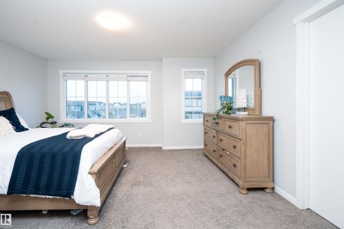 Wall-to-wall carpeting and multiple windows create a bright atmosphere - 9232 224 St Nw Nw, Edmonton, AB 