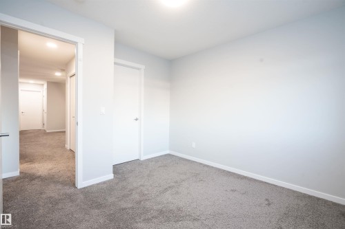 Wall-to-wall carpeting and neutral wall tones - 9232 224 St Nw Nw, Edmonton, AB 