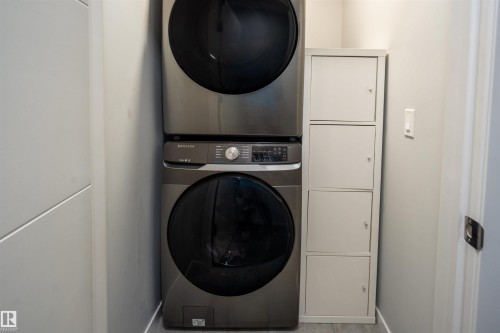 Stackable washer and dryer unit with a four-compartment storage cabinet - 9232 224 St Nw Nw, Edmonton, AB 