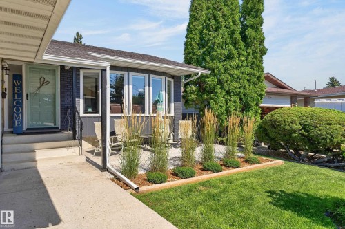 Front exterior featuring a concrete walkway, steps, and porch - 18316 71 Avenue Nw, Edmonton, AB 