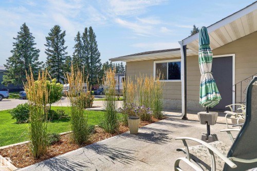Concrete patio with direct access to the property - 18316 71 Avenue Nw, Edmonton, AB 