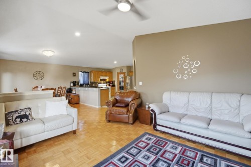 Wood-finish flooring, recessed lighting, and a ceiling fan - 5132 157 Avenue Nw, Edmonton, AB 
