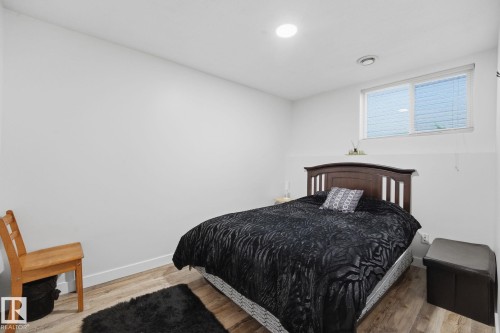 Wood-finish flooring, recessed lighting, and a window with blinds - 5132 157 Avenue Nw, Edmonton, AB 