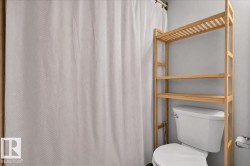 White toilet fixture with chrome flush lever - 