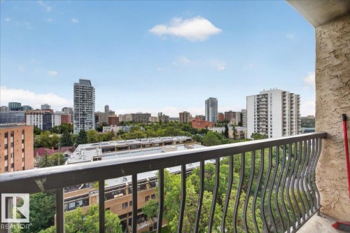 Balcony with decorative metal railing and textured wall finish - #1102 9916 113 St Nw, Edmonton, AB 