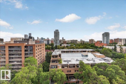 Expansive urban skyline featuring multiple high-rise buildings and abundant mature trees - #1102 9916 113 St Nw, Edmonton, AB 
