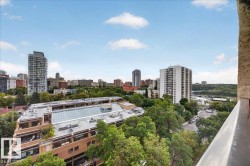 Cityscape with varied architectural styles and mature tree canopy - 