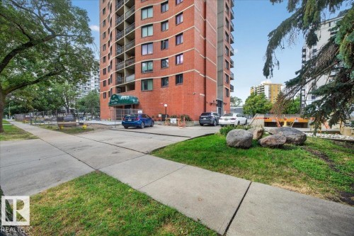 Brick-clad high-rise building with a portico entrance and multiple balconies - #1102 9916 113 St Nw, Edmonton, AB 