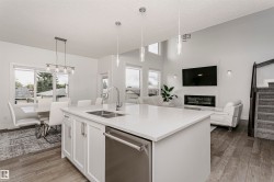 Open concept design with wood-finish flooring - 