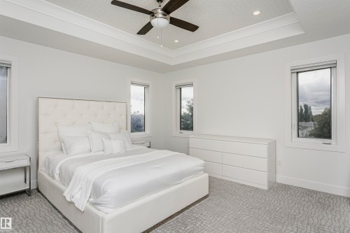 Tray ceiling with recessed lighting and a ceiling fan - 9107 181 Avenue Nw, Edmonton, AB 