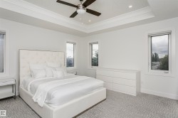 Tray ceiling with recessed lighting and a ceiling fan - 