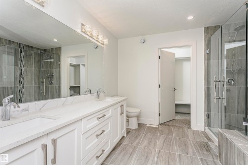 Dual vanity with undermount sinks and white countertops - 9107 181 Avenue Nw, Edmonton, AB 