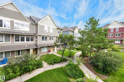 Multi-story residential buildings featuring gabled roofs and varied siding textures - #72 603 Watt Bv Sw Sw, Edmonton, AB 