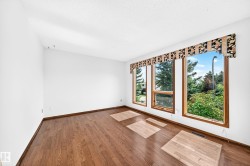 Rich wood-finish flooring complements the neutral wall tones - 