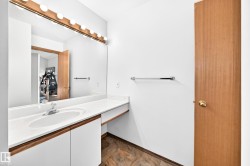 Vanity with an integrated sink, polished chrome faucet, and ample countertop space - 