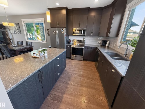 124 Gilmore Way, Spruce Grove, AB - Indoor Photo Showing Kitchen With Double Sink With Upgraded Kitchen