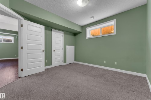 Recessed windows, white trim, flat panel doors, and grey carpeting - 11421 82 Street Nw, Edmonton, AB 
