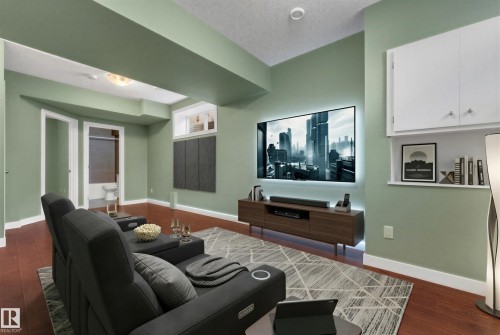 Wood-finish flooring with light green wall tones - 11421 82 Street Nw, Edmonton, AB 