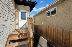 Entry porch with wood stairs and railing - 