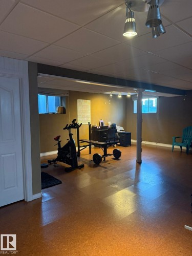 Recessed windows, overhead track lighting, panel door, and finished flooring - 124 Ward Crescent Nw Nw, Edmonton, AB 
