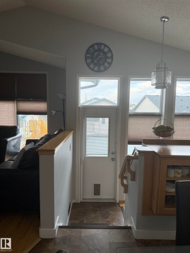 Vaulted ceiling with a contemporary pendant light fixture - 124 Ward Crescent Nw Nw, Edmonton, AB 
