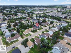 Residential neighborhood with established tree cover and paved roads - 