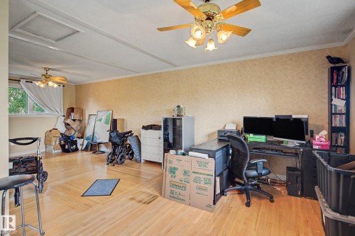 Hardwood-finish flooring, recessed lighting, and dual ceiling fans - 11431 51 Avenue Nw, Edmonton, AB 