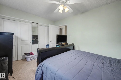 Recessed closet with white bi-fold doors - 11431 51 Avenue Nw, Edmonton, AB 