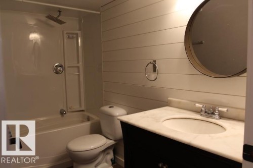 Shower/tub combination with a rainfall showerhead - 64 Apache Crescent, Leduc, AB 