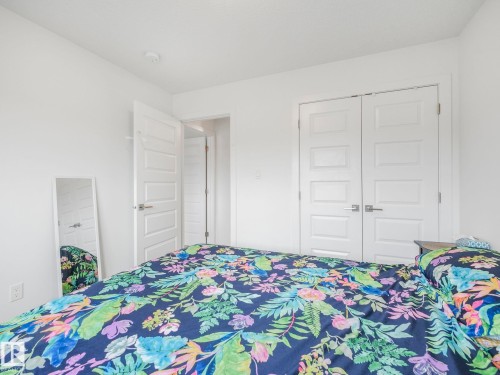 Recessed ceiling lighting, white interior doors with contemporary hardware, and white wall finishes - 3807 Weidle Crescent Sw, Edmonton, AB 