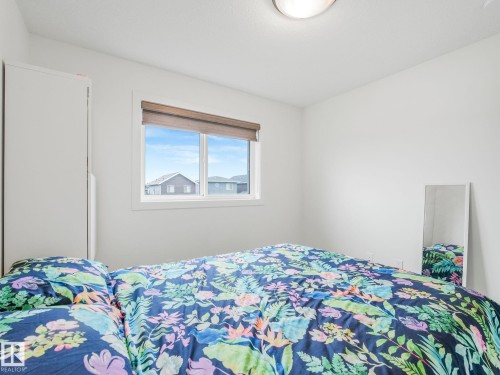 White walls, a white ceiling, and a flush-mount ceiling light fixture - 3807 Weidle Crescent Sw, Edmonton, AB 