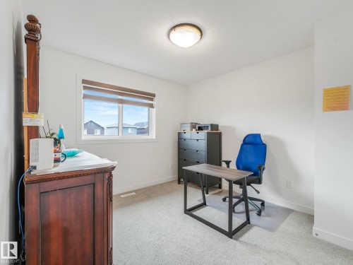 Light-colored carpeting, a single window with blinds, and white walls - 3807 Weidle Crescent Sw, Edmonton, AB 