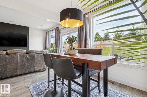 Contemporary light fixture with a gold interior - 22434 99A Avenue Nw, Edmonton, AB 