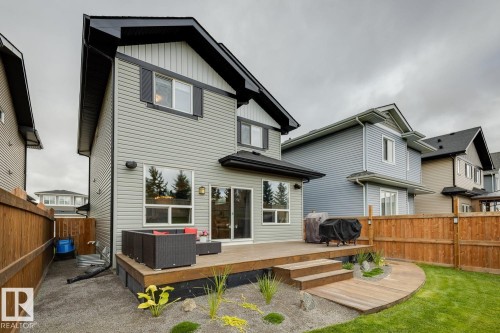 Rear exterior with gray siding and black trim accents - 22434 99A Avenue Nw, Edmonton, AB 
