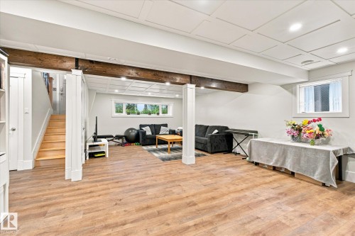 Recessed lighting, wood-finish flooring, exposed wood beams, coffered ceiling, and white trim windows - 3 Akins Drive, St. Albert, AB 