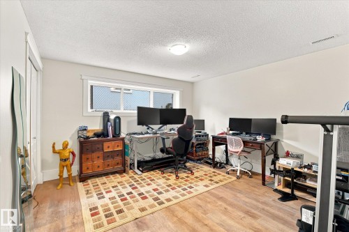 Wood-finish flooring with white walls and a ceiling-mounted light fixture - 3 Akins Drive, St. Albert, AB 