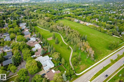 Expansive green spaces and mature trees surround residential properties - 3 Akins Drive, St. Albert, AB 