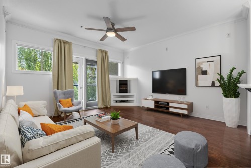 Recessed lighting, crown molding, wood-finish flooring, ceiling fan, and large windows with transom panels - #210 10121 80 Av Nw, Edmonton, AB 