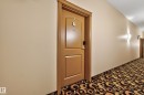 Wood-finish door with smart lock entry - #210 10121 80 Av Nw, Edmonton, AB 