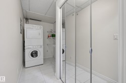 Stackable laundry appliances, wire shelving, and mirrored closet doors - 