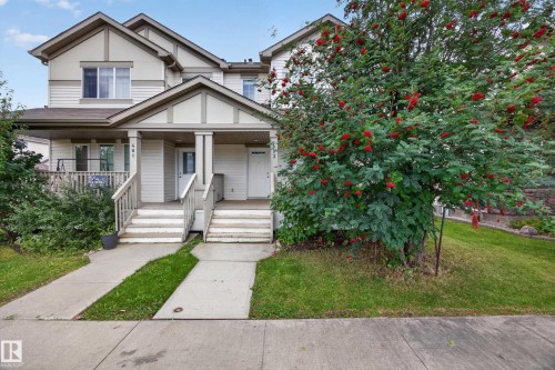 Two-story exterior with light-colored siding - 483 Watt Boulevard Sw, Edmonton, AB 