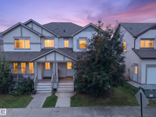 Multi-level townhouse exterior featuring siding construction and gabled rooflines - 483 Watt Boulevard Sw, Edmonton, AB 