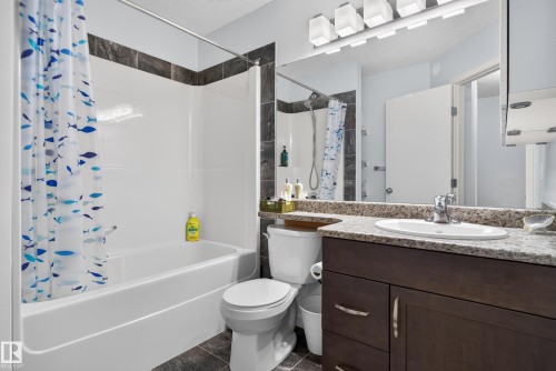 Full vanity mirror with contemporary lighting - 17363 120 Street Nw, Edmonton, AB 