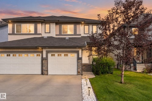 Two-story exterior with light-toned siding and dark trim accents - 17363 120 Street Nw, Edmonton, AB 
