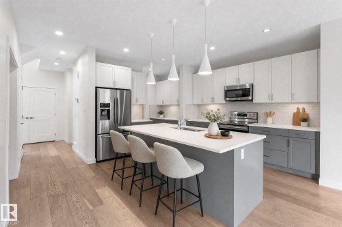 38 Ellice Bend, Fort Saskatchewan, AB - Indoor Photo Showing Kitchen With Double Sink With Upgraded Kitchen