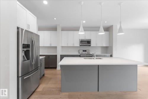 38 Ellice Bend, Fort Saskatchewan, AB - Indoor Photo Showing Kitchen With Double Sink With Upgraded Kitchen