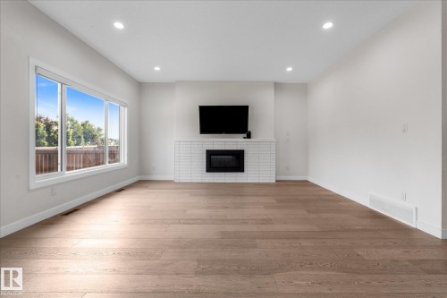 38 Ellice Bend, Fort Saskatchewan, AB - Indoor Photo Showing Other Room With Fireplace