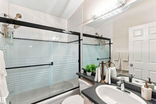 Vanity with an oval undermount sink and chrome faucet - #6 15 Poirier Av, St. Albert, AB 